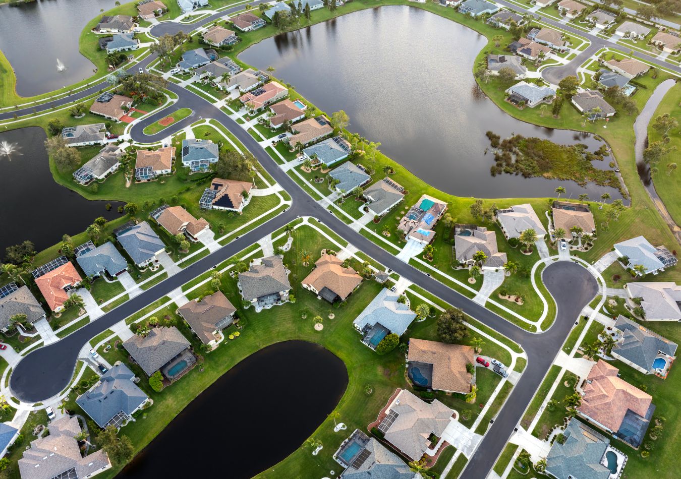 Aerial view of a Tampa Bay area neighborhood with homes surrounding a retention pond